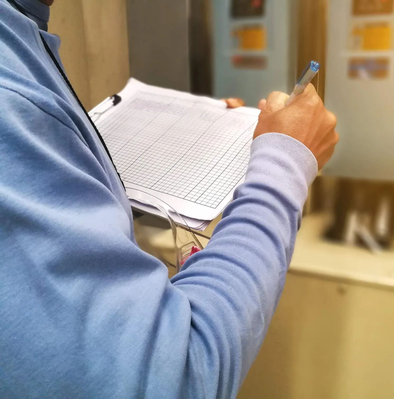 Electrician reviewing paperwork on a clipboard